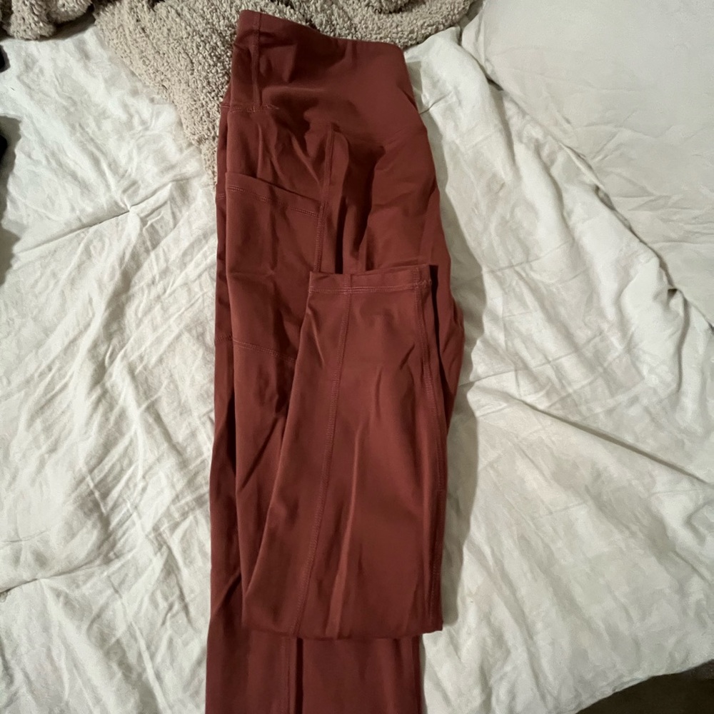 Rust orange leggings from yogalicious. Super comfy with side pocket for phone!